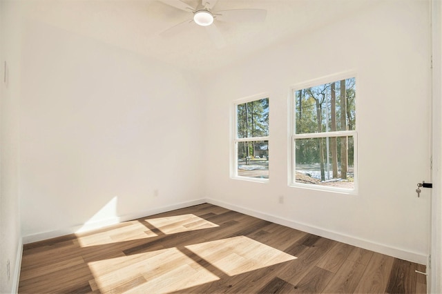 empty room with hardwood / wood-style floors and ceiling fan