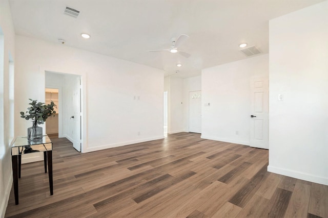 unfurnished room featuring ceiling fan and dark hardwood / wood-style floors