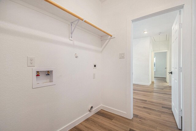 laundry room with hardwood / wood-style flooring, electric dryer hookup, washer hookup, and hookup for a gas dryer