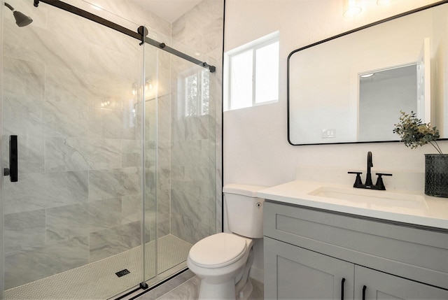 bathroom with walk in shower, vanity, and toilet