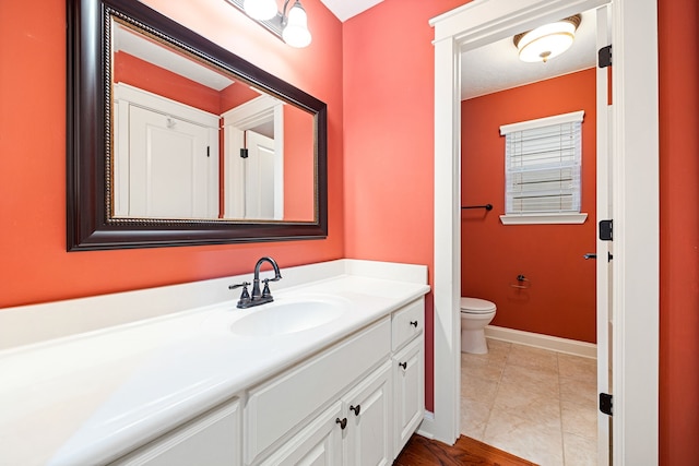 bathroom with vanity and toilet