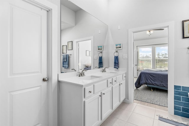 bathroom with tile patterned flooring and vanity