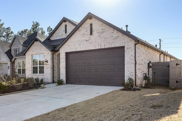 french country style house featuring a garage