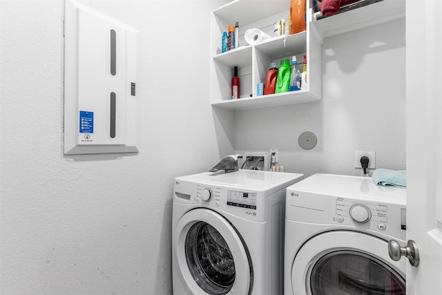 laundry area with washing machine and dryer