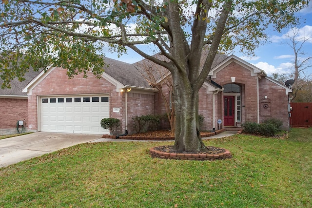 single story home featuring a garage and a front yard