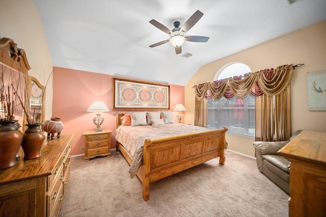 bedroom with vaulted ceiling, light carpet, and ceiling fan