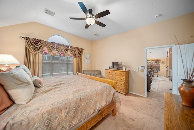 carpeted bedroom featuring ceiling fan and lofted ceiling