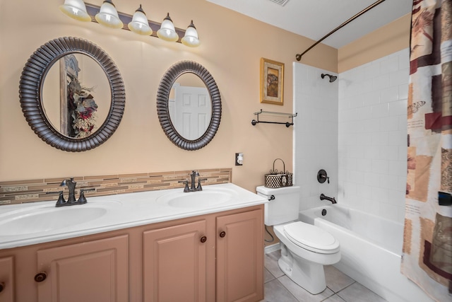 full bathroom with tile patterned floors, toilet, tasteful backsplash, vanity, and shower / bath combo