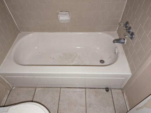 bathroom with tile patterned floors and toilet