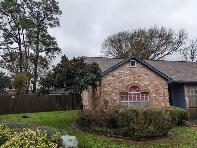 view of home's exterior featuring a yard