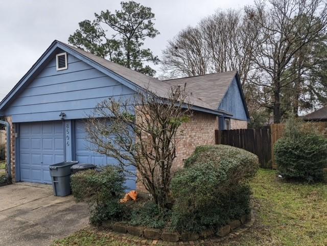 view of side of property featuring a garage