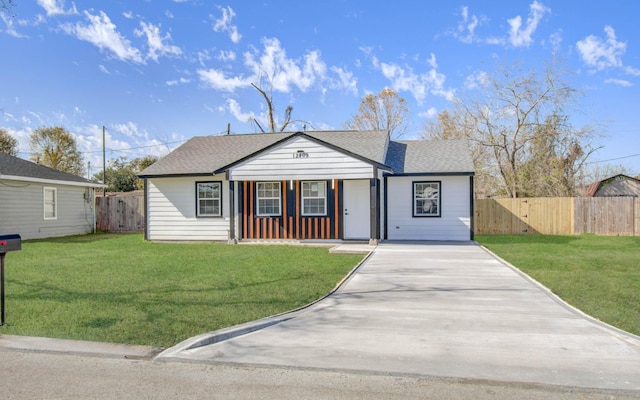 view of front of home with a front yard and covered porch