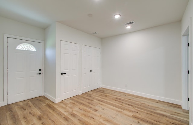 entrance foyer featuring light hardwood / wood-style floors