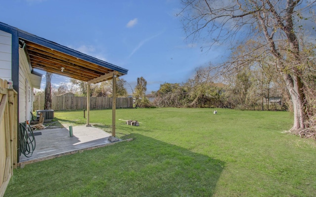 view of yard featuring a patio and central AC