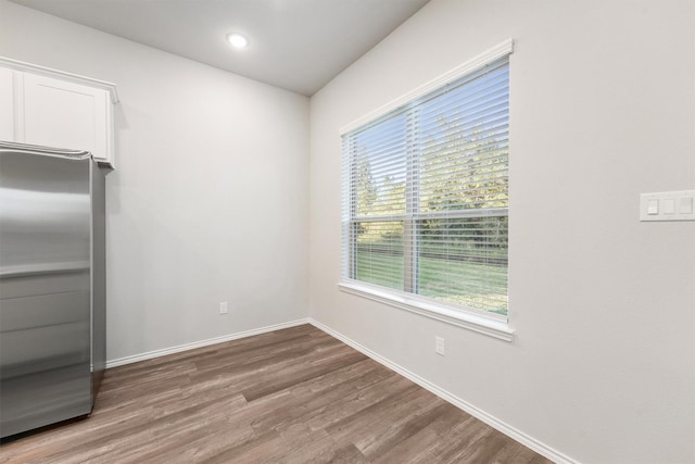 unfurnished dining area with hardwood / wood-style floors