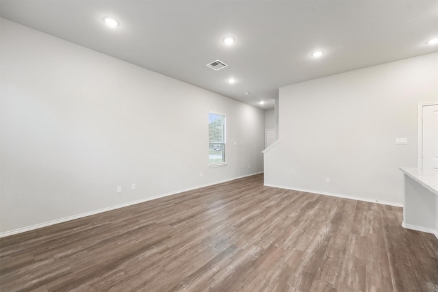 spare room with wood-type flooring