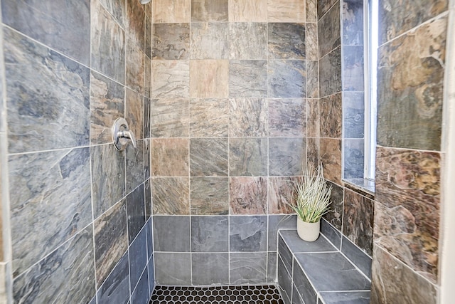 bathroom featuring tiled shower