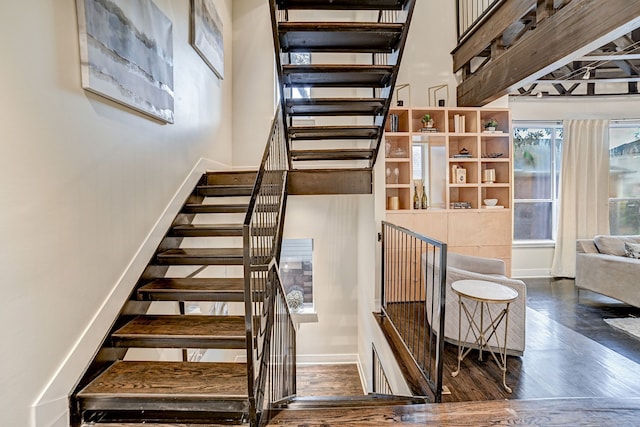 stairs with wood-type flooring