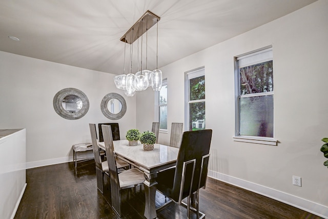 dining space with dark wood-type flooring