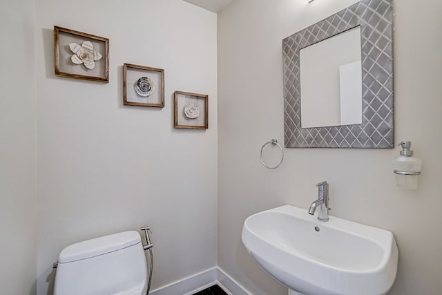 bathroom with toilet and sink