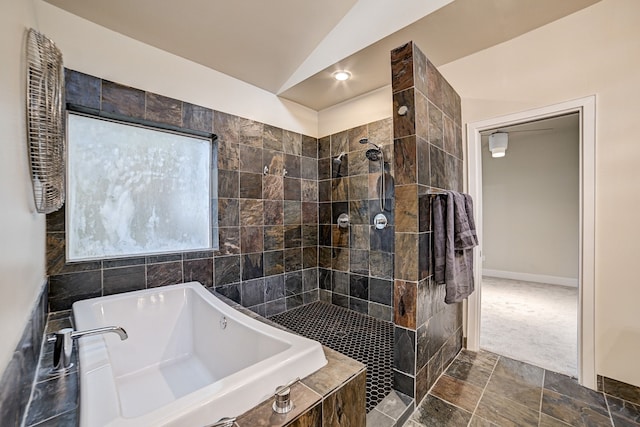 bathroom with lofted ceiling and independent shower and bath