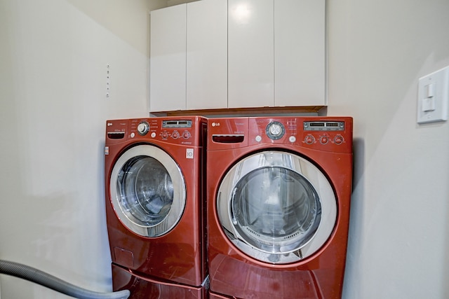 laundry area with cabinets and washer and dryer