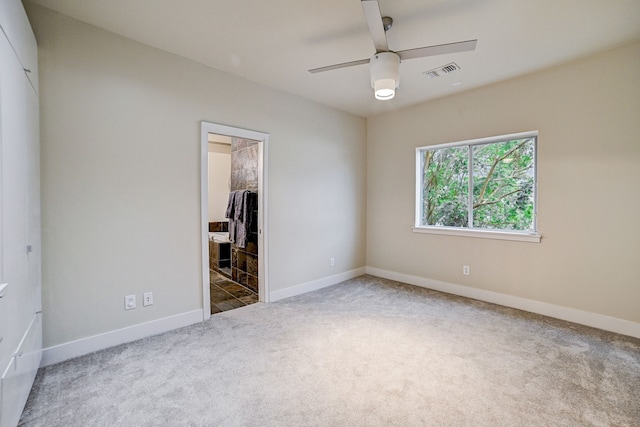 unfurnished bedroom with a spacious closet, carpet floors, a closet, and ceiling fan