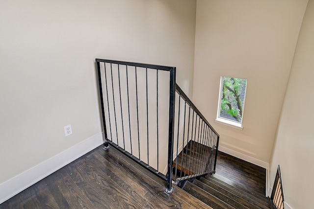 stairs featuring hardwood / wood-style floors