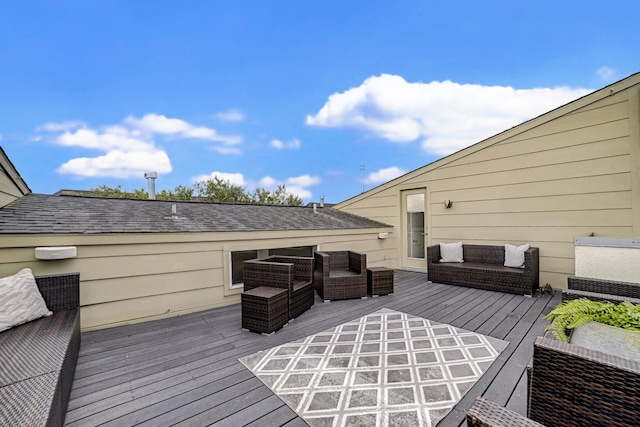 wooden terrace with outdoor lounge area