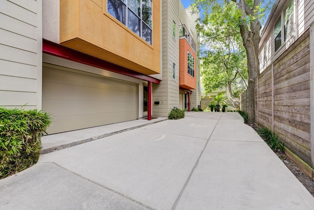 view of property exterior with a garage