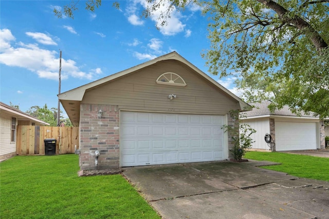 garage featuring a lawn