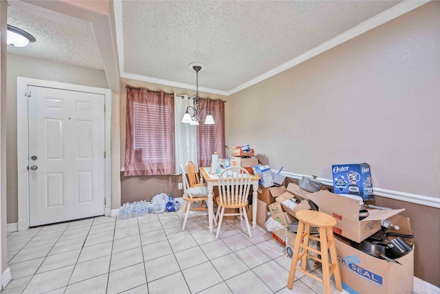 dining area featuring a notable chandelier, ornamental molding, a textured ceiling, and light tile patterned flooring