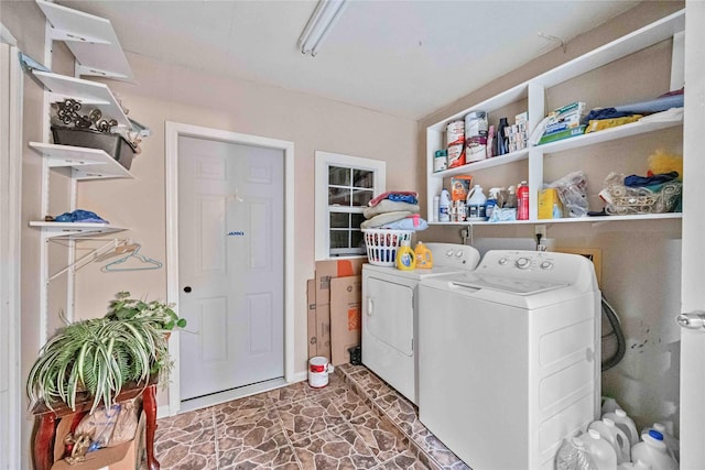 clothes washing area featuring washing machine and clothes dryer