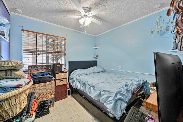 bedroom featuring crown molding, light hardwood / wood-style flooring, and a textured ceiling