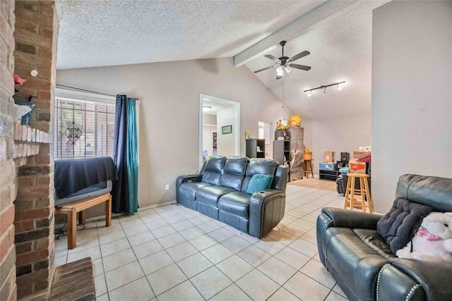 living room with ceiling fan, light tile patterned floors, a textured ceiling, and vaulted ceiling with beams