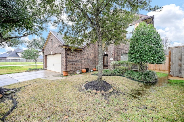 view of front of home featuring a garage and a front lawn