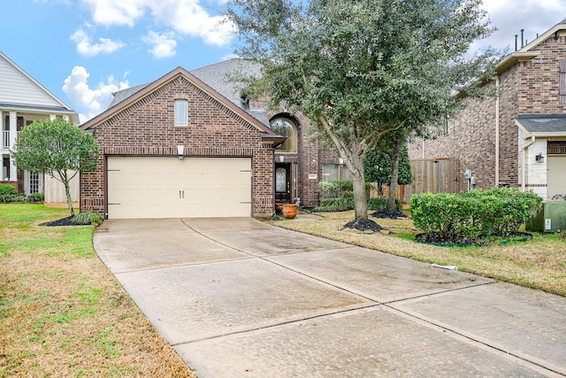 front of property with a garage and a front yard