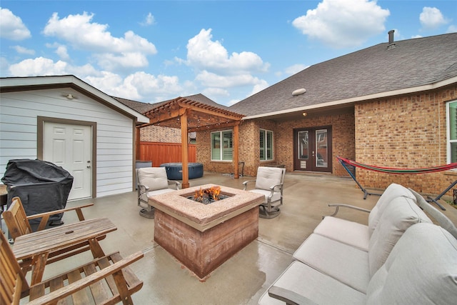 view of patio / terrace with grilling area and an outdoor fire pit