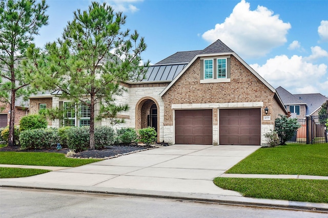 view of front facade with a garage and a front yard