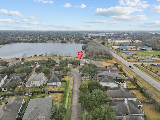 birds eye view of property featuring a water view