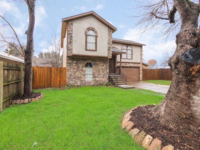 view of front of home featuring a garage and a front lawn