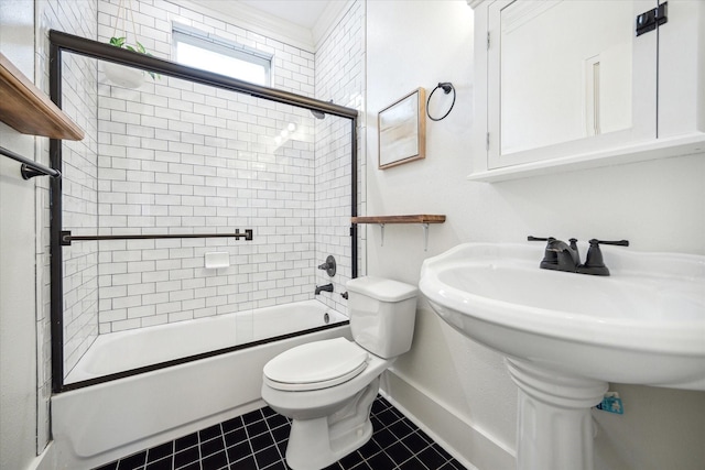 bathroom featuring tile patterned flooring, enclosed tub / shower combo, and toilet