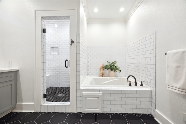 bathroom featuring tile patterned flooring, ornamental molding, shower with separate bathtub, and vanity