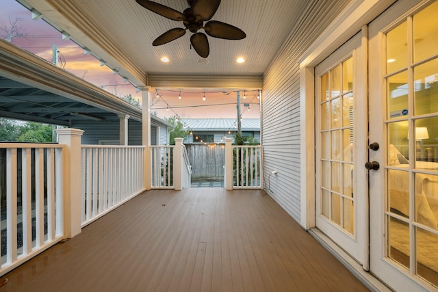 deck at dusk with ceiling fan