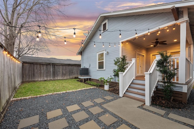 exterior space featuring cooling unit and ceiling fan