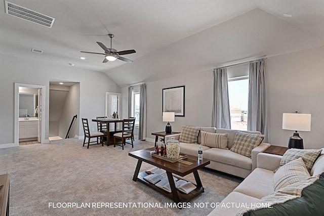 living room with lofted ceiling, carpet, visible vents, and baseboards