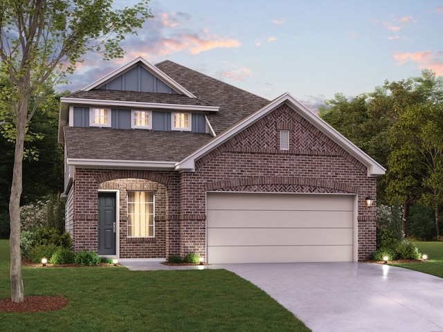 view of front of house featuring an attached garage, brick siding, a shingled roof, driveway, and a front lawn