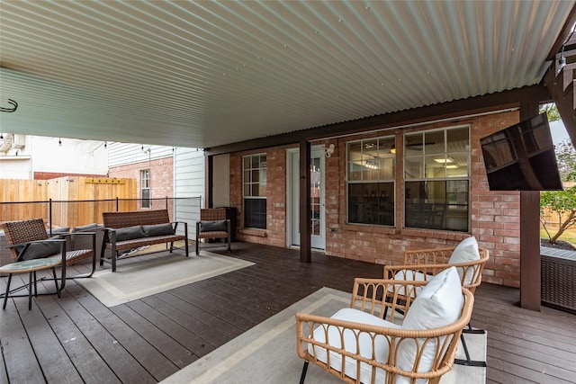 wooden terrace with outdoor lounge area