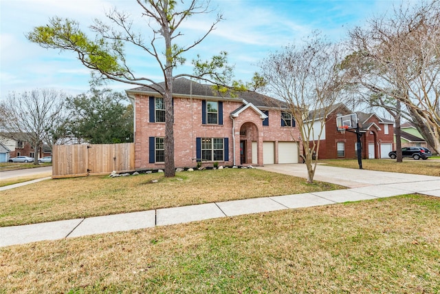 view of front of house featuring a garage and a front lawn