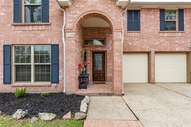 view of exterior entry featuring a garage